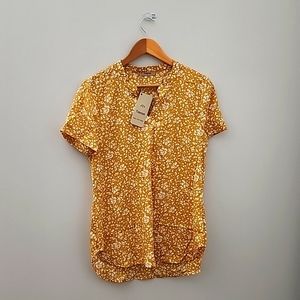 Yellow floral short sleeve blouse.